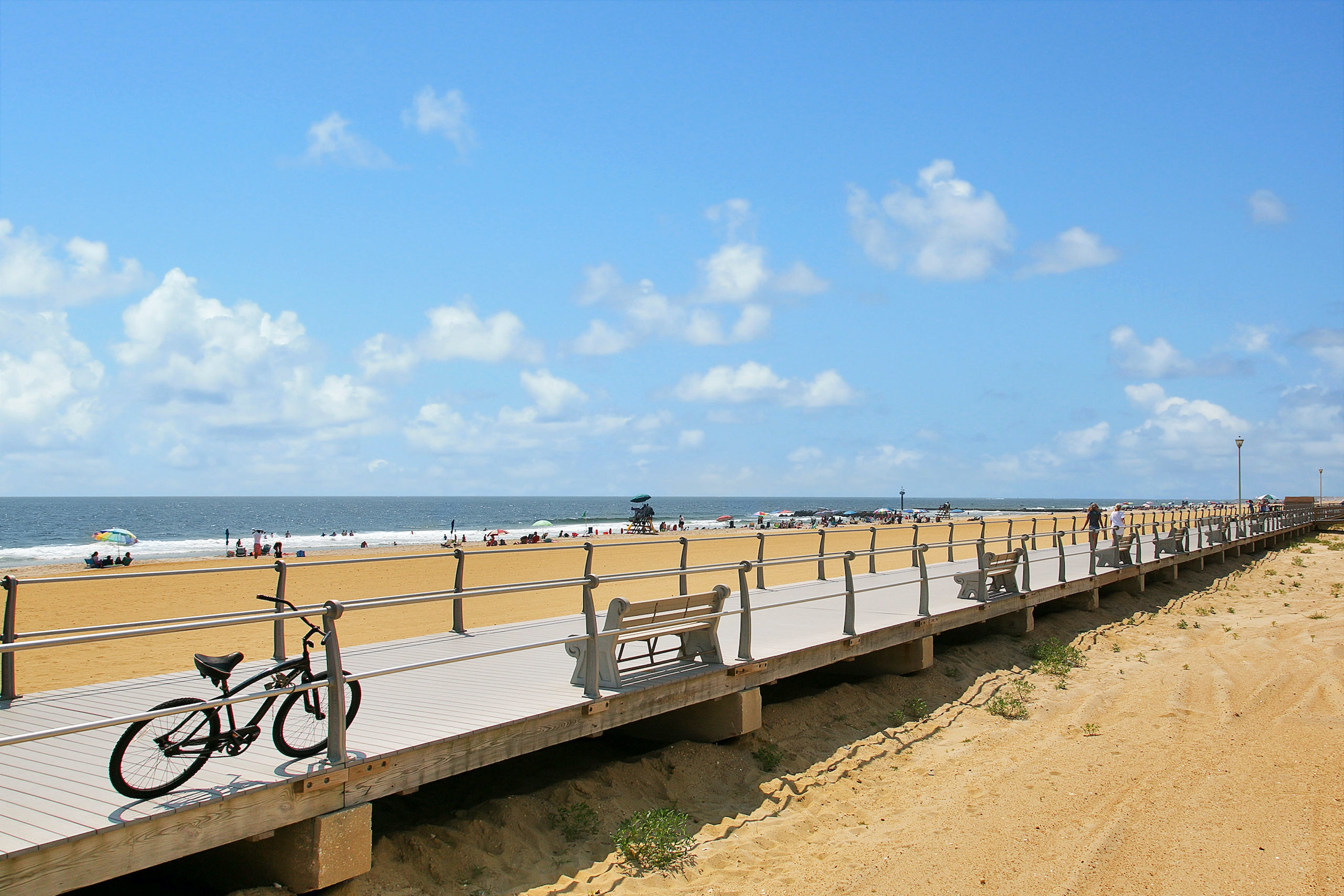 Sunny boardwalk and beach in Spring Lake, New Jersey